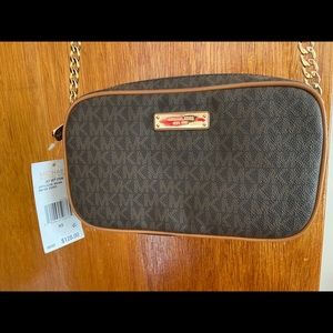 Women’s brown Micheal Kors crossbody bag